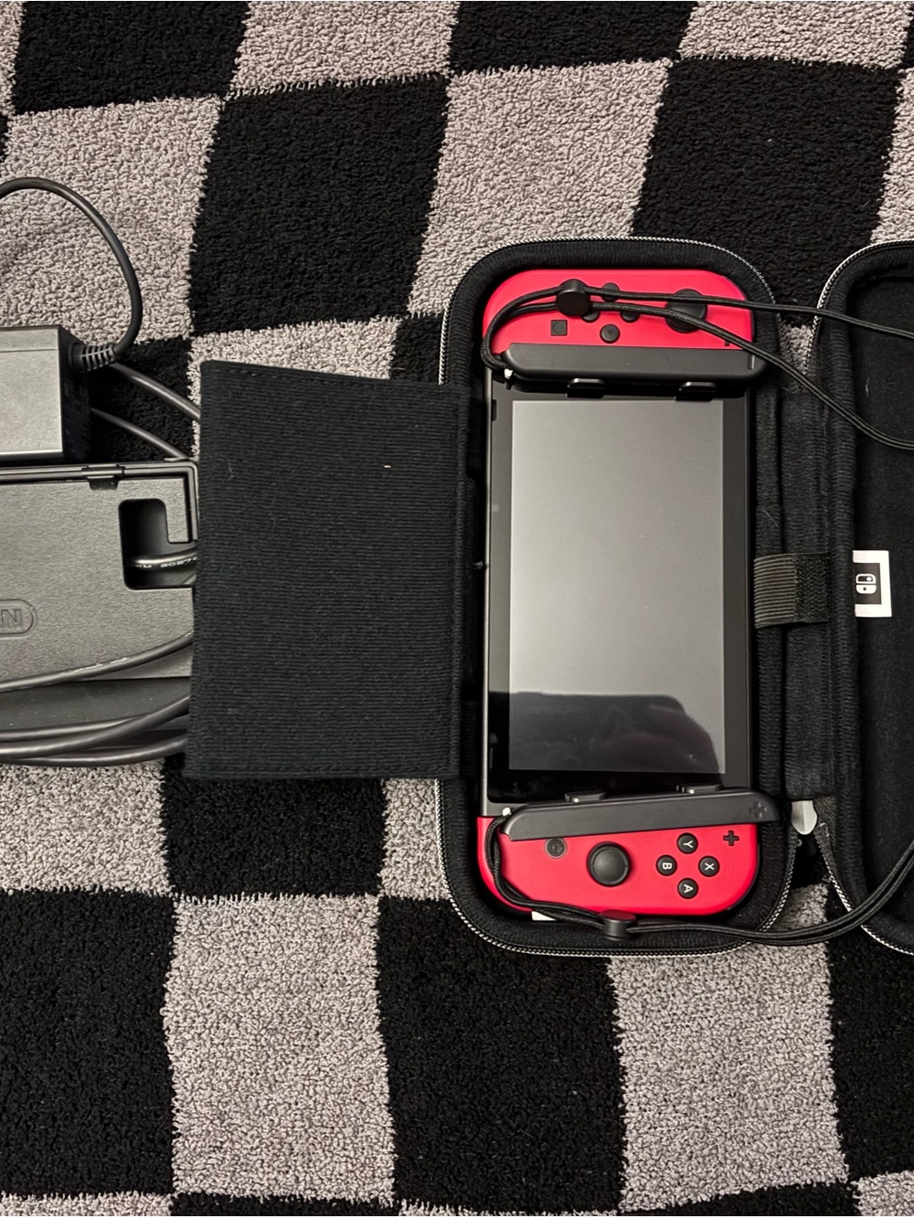 Nintendo Switch with Red Joy‑Con Controllers and Travel Case